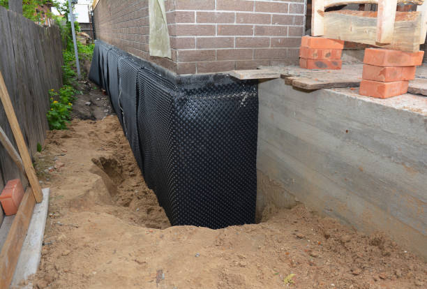 Happy homeowners after waterproofing job in Clinton